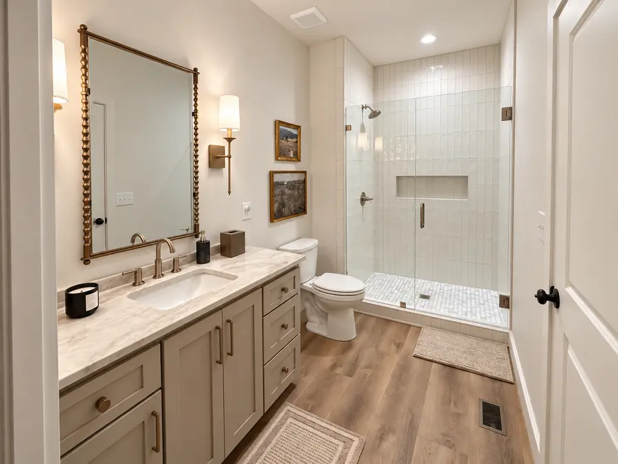 Guest bathroom with walk-in shower in a Still Oak custom home